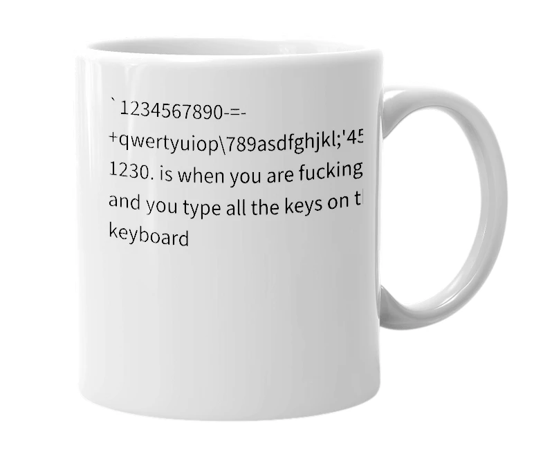 White mug with the definition of '`1234567890-=-+qwertyuiop[]\789asdfghjkl;'456zxcvbnmm,./1230.'