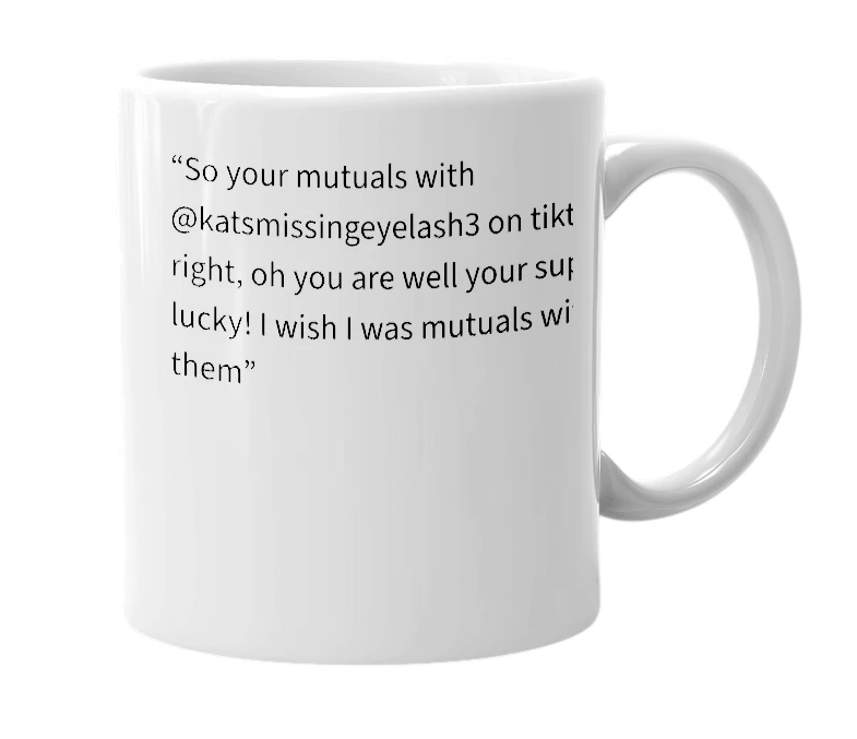 White mug with the definition of 'katsmissingeyelash3'