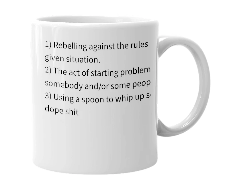 White mug with the definition of 'stir up trouble'