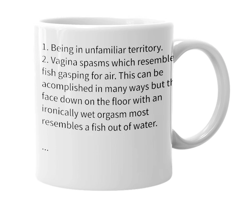 White mug with the definition of 'Fish Out Of Water'