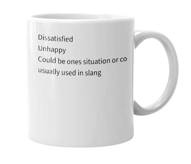 White mug with the definition of 'Complacent'