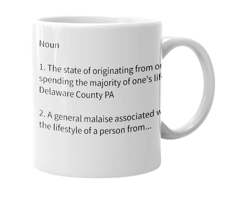 White mug with the definition of 'Delcomyddia'