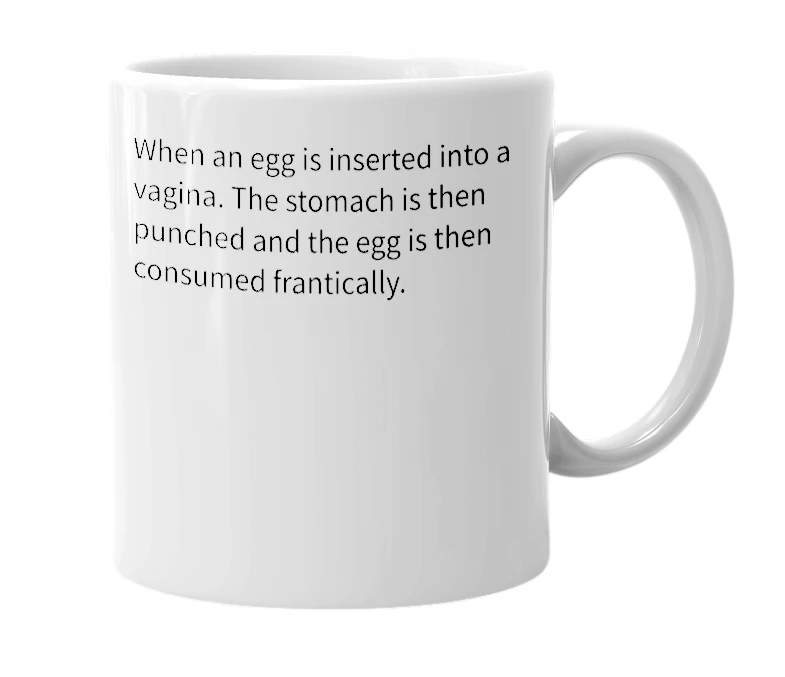 White mug with the definition of 'Cumberland Scotch Egg'