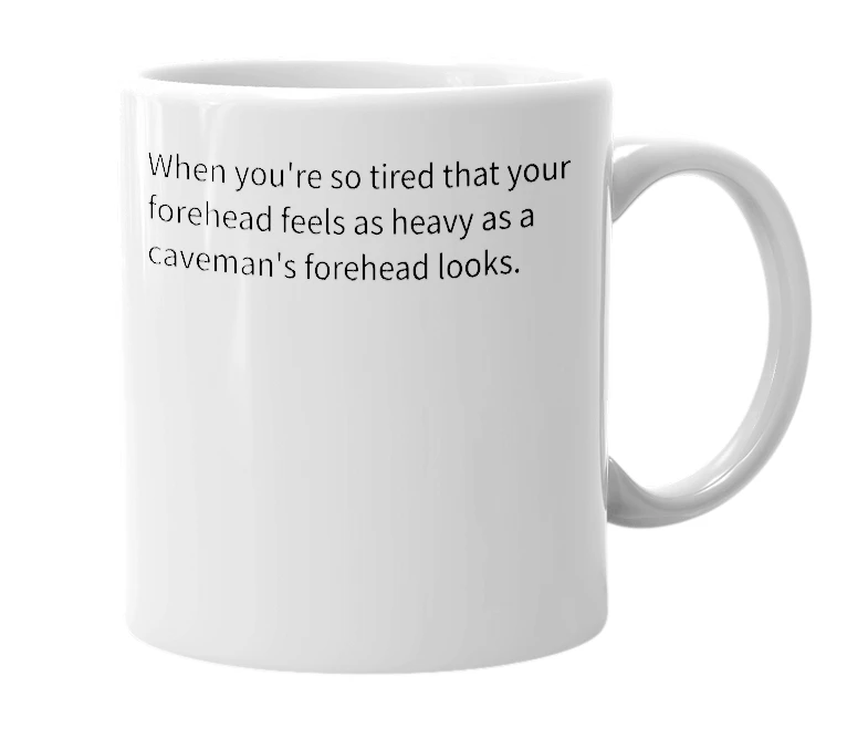 White mug with the definition of 'Omega Caveman'