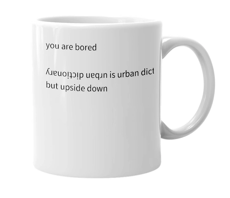 White mug with the definition of 'ʎɹɐuoᴉʇɔᴉp uɐqɹn'