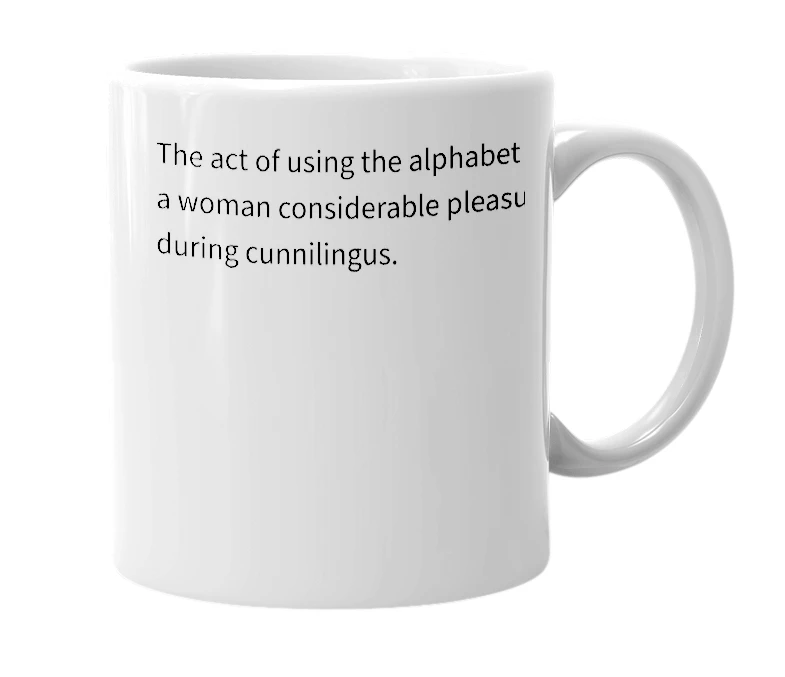 White mug with the definition of 'Alphabet'