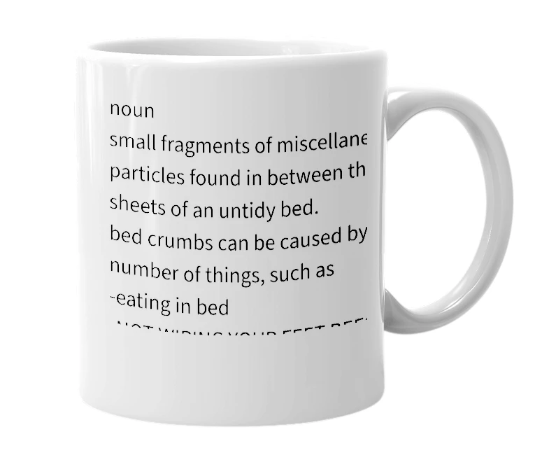 White mug with the definition of 'Bed Crumbs'