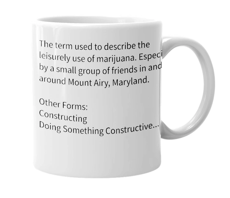White mug with the definition of 'Constructing'