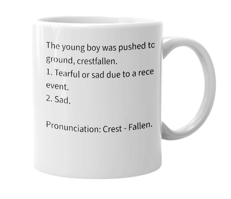 White mug with the definition of 'Crestfallen'