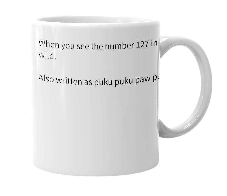 White mug with the definition of 'Puku puku pow pow'