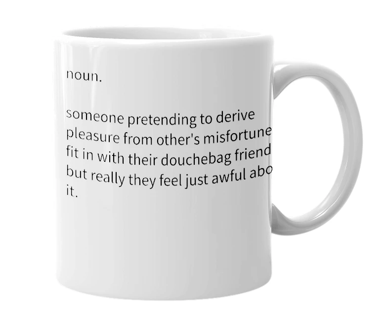 White mug with the definition of 'Schadenfraud'