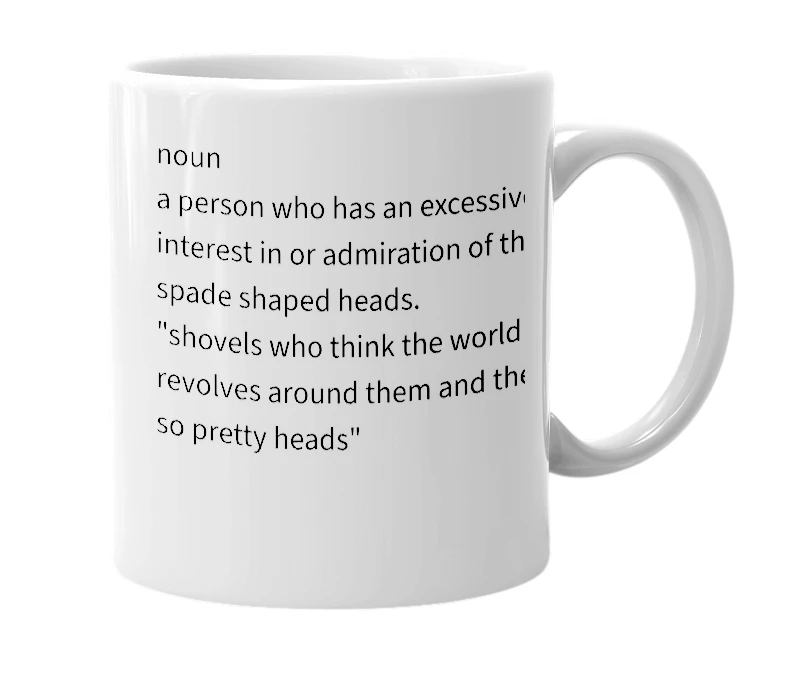 White mug with the definition of 'Shovel'