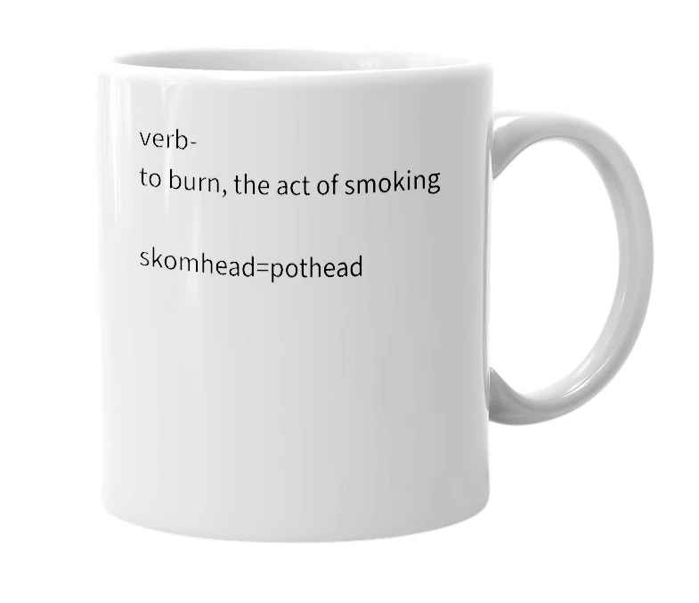 White mug with the definition of 'Skom'