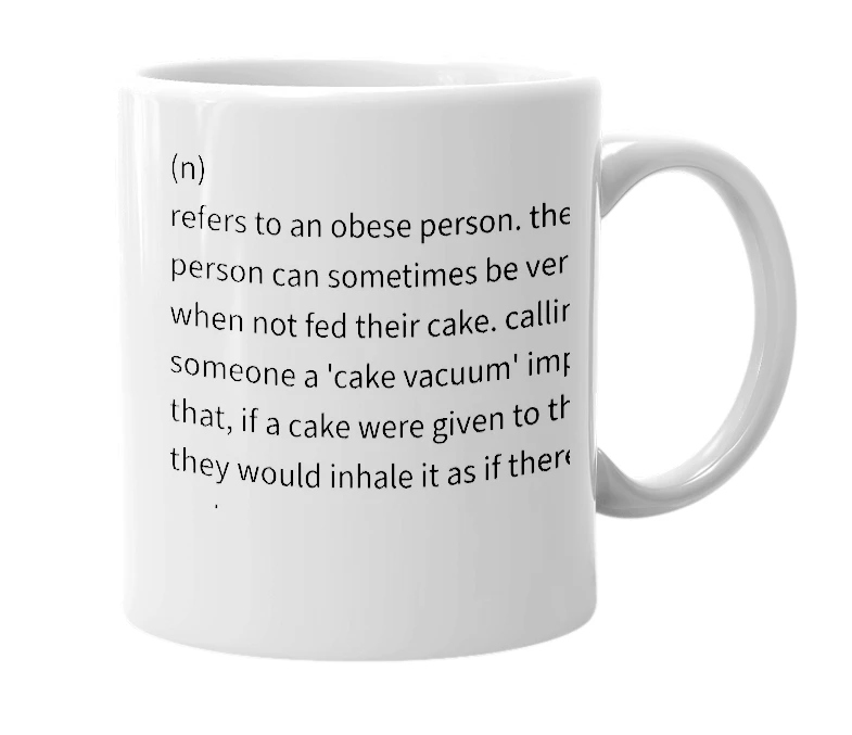 White mug with the definition of 'cake vacuum'