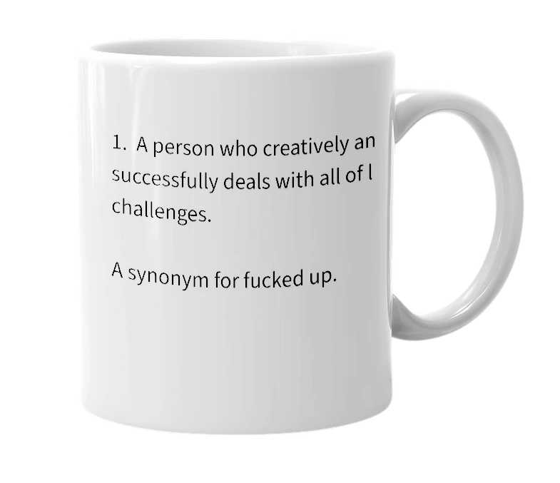 White mug with the definition of 'challenged'