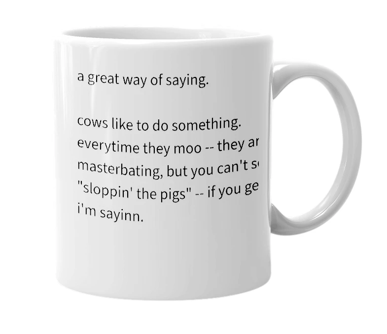 White mug with the definition of 'cows moo'