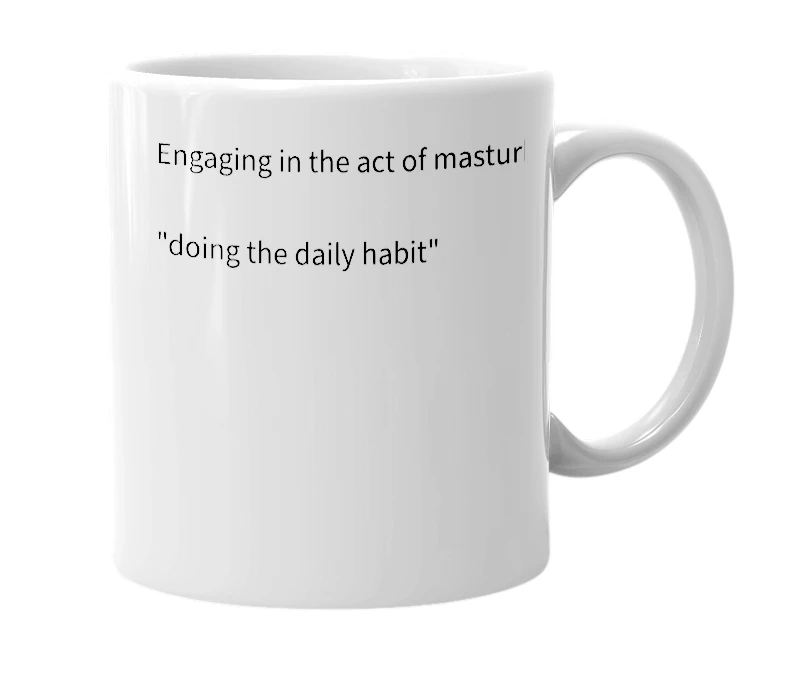 White mug with the definition of 'daily habit'