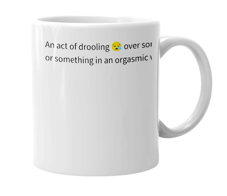 White mug with the definition of 'malicating'