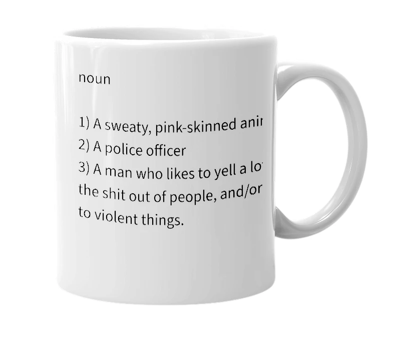 White mug with the definition of 'pig'