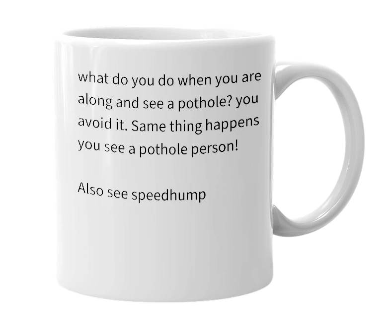 White mug with the definition of 'pothole'
