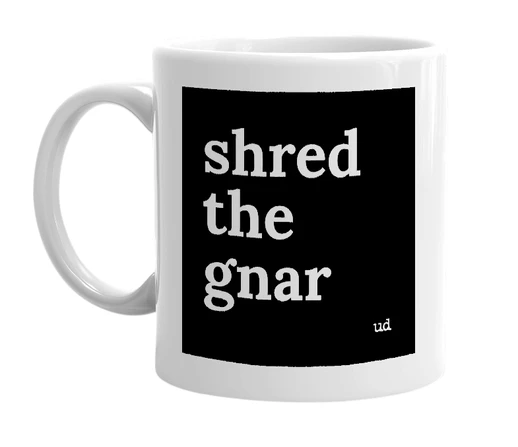 White mug with 'shred the gnar' in bold black letters