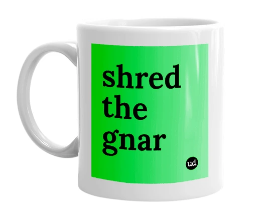 White mug with 'shred the gnar' in bold black letters