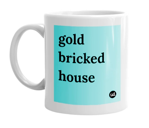 White mug with 'gold bricked house' in bold black letters