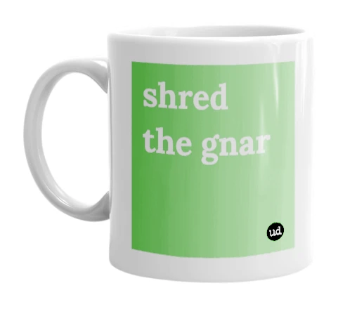 White mug with 'shred the gnar' in bold black letters