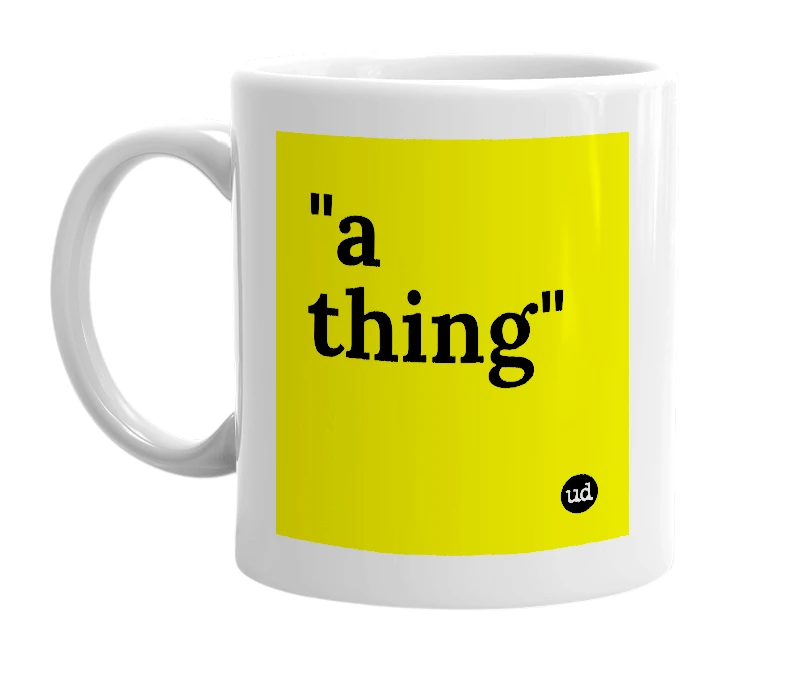 White mug with '"a thing"' in bold black letters