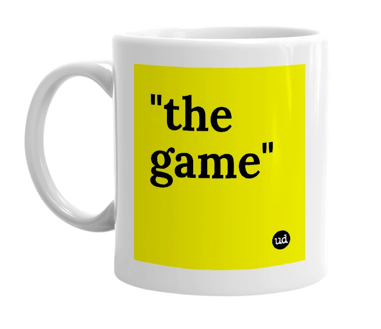 White mug with '"the game"' in bold black letters