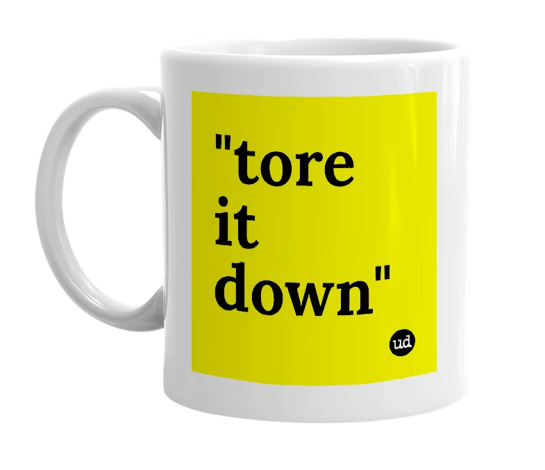 White mug with '"tore it down"' in bold black letters