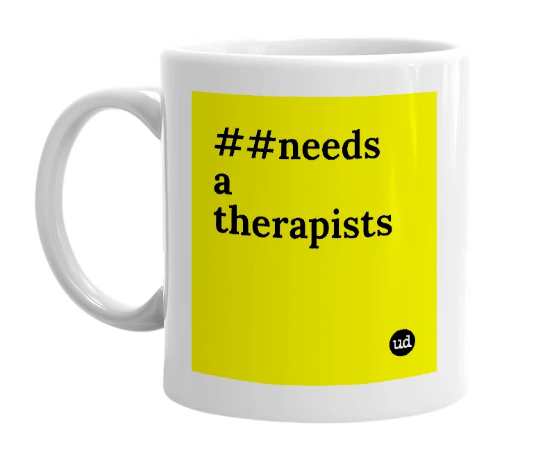 White mug with '##needs a therapists' in bold black letters