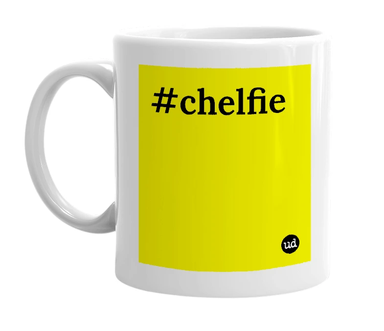 White mug with '#chelfie' in bold black letters