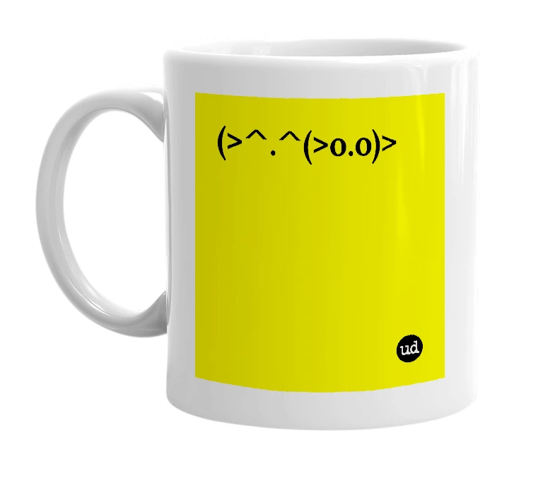 White mug with '(>^.^(>o.o)>' in bold black letters