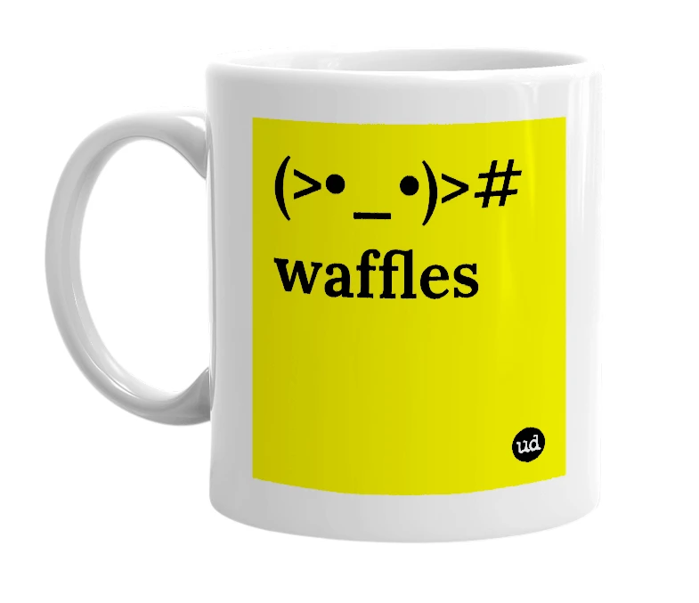 White mug with '(>•_•)># waffles' in bold black letters