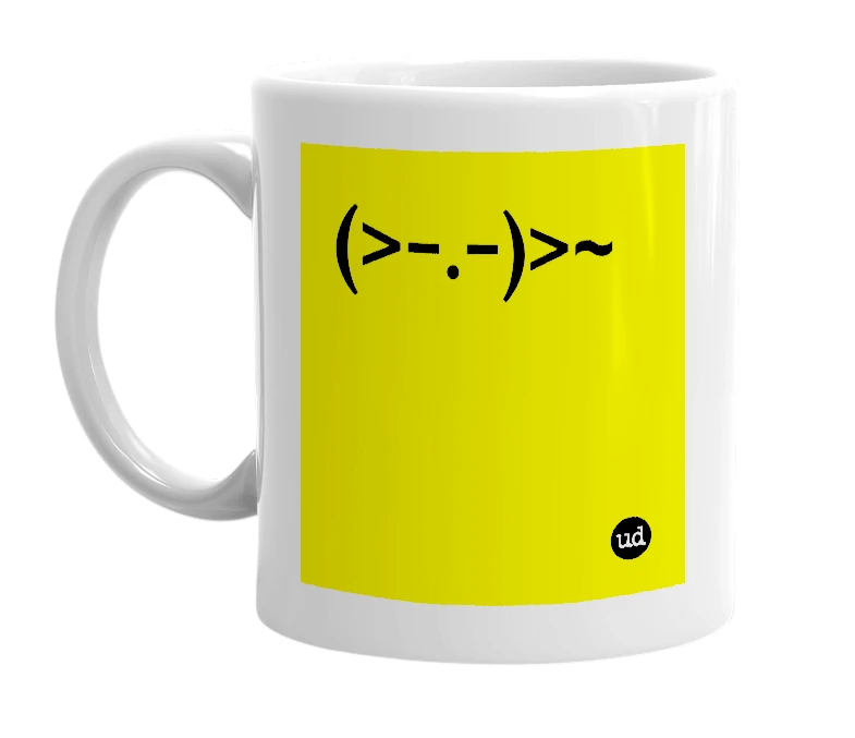 White mug with '(>-.-)>~' in bold black letters
