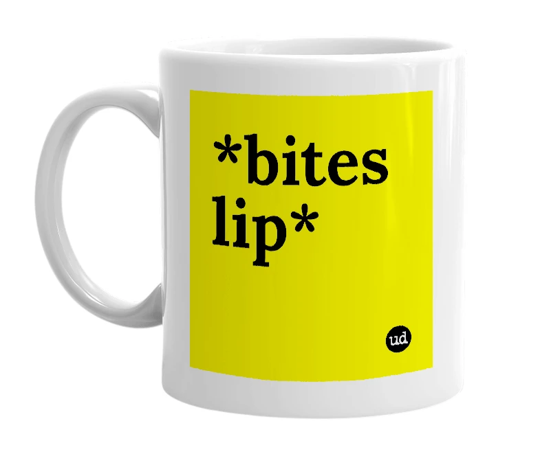 White mug with '*bites lip*' in bold black letters