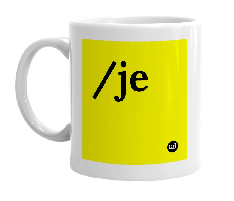 White mug with '/je' in bold black letters
