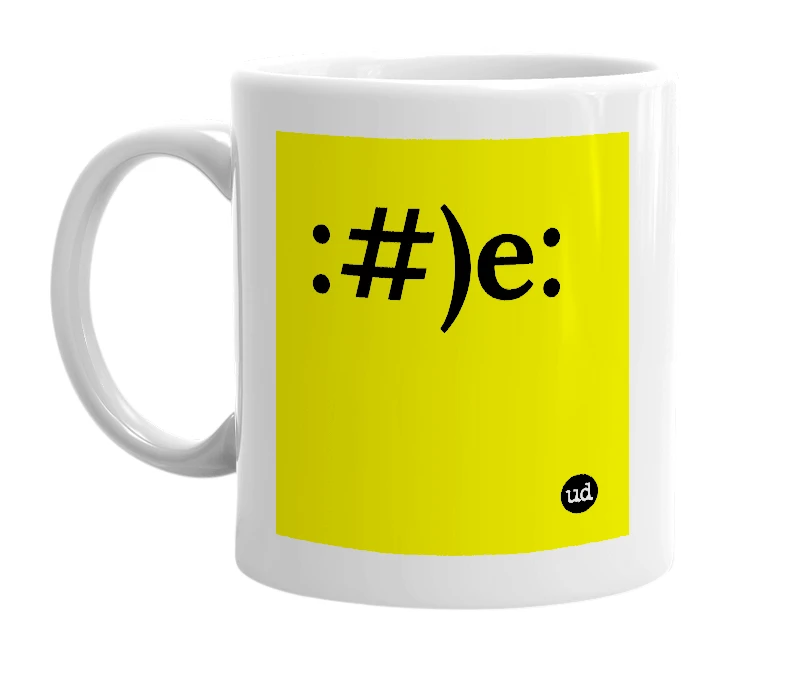 White mug with ':#)e:' in bold black letters