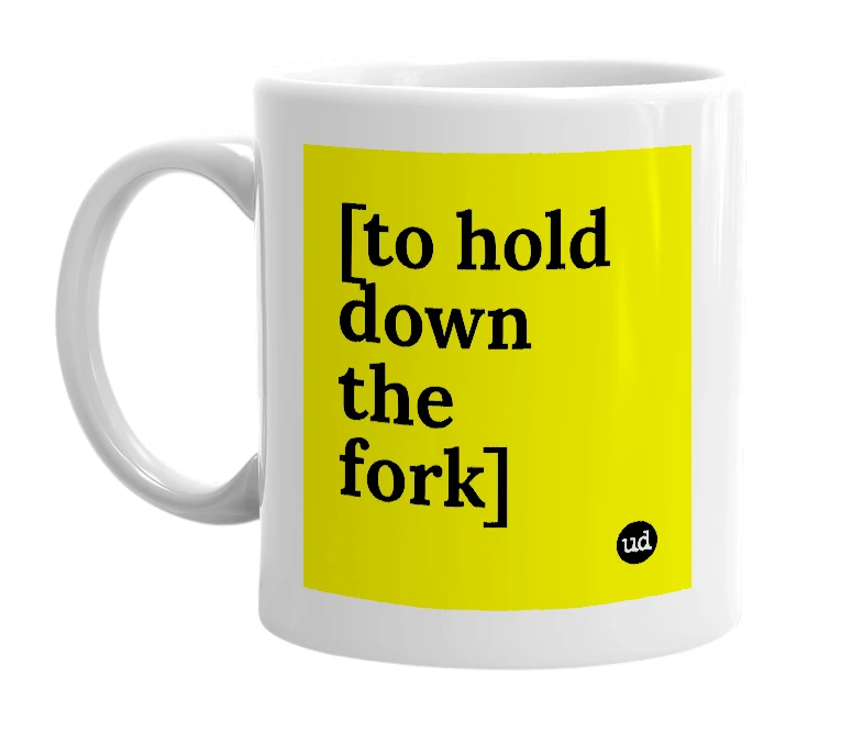 White mug with '[to hold down the fork]' in bold black letters