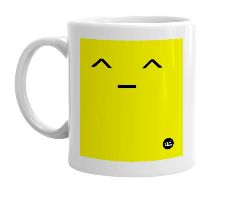 White mug with '^_^' in bold black letters