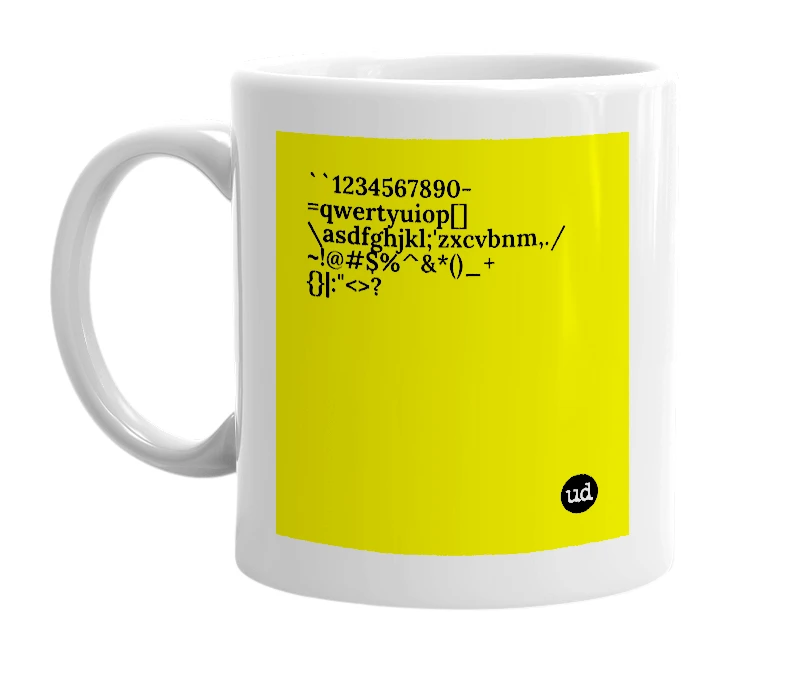 White mug with '``1234567890-=qwertyuiop[]\asdfghjkl;'zxcvbnm,./ ~!@#$%^&*()_+{}|:"<>?' in bold black letters