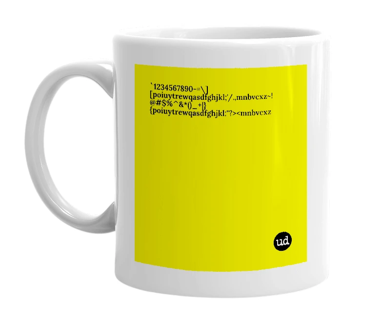 White mug with '`1234567890-=\][poiuytrewqasdfghjkl;'/.,mnbvcxz~!@#$%^&*()_+|}{poiuytrewqasdfghjkl:"?><mnbvcxz' in bold black letters