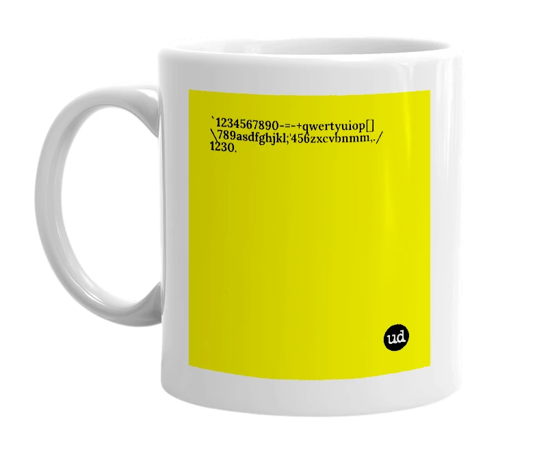 White mug with '`1234567890-=-+qwertyuiop[]\789asdfghjkl;'456zxcvbnmm,./1230.' in bold black letters