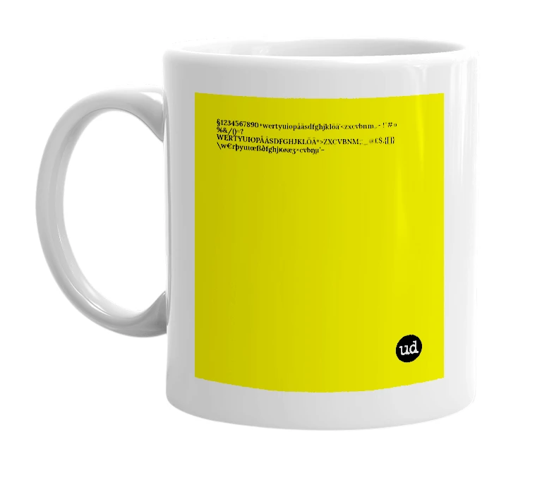 White mug with '§1234567890+wertyuiopåäsdfghjklöä'<zxcvbnm,.- !"#¤%&/()=?WERTYUIOPÅÂSDFGHJKLÖÄ*>ZXCVBNM;:_@£$‚{[]}\w€rþyuıœßðfghjĸøæʒ×cvbŋµ’–' in bold black letters