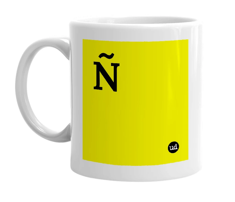 White mug with 'Ñ' in bold black letters