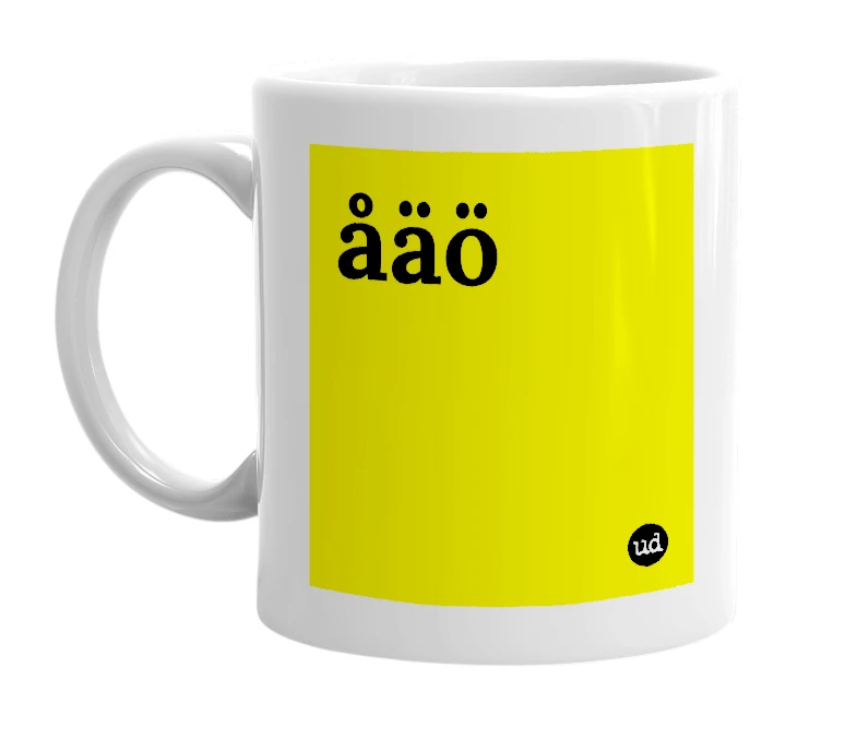 White mug with 'åäö' in bold black letters