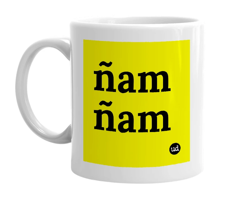 White mug with 'ñam ñam' in bold black letters