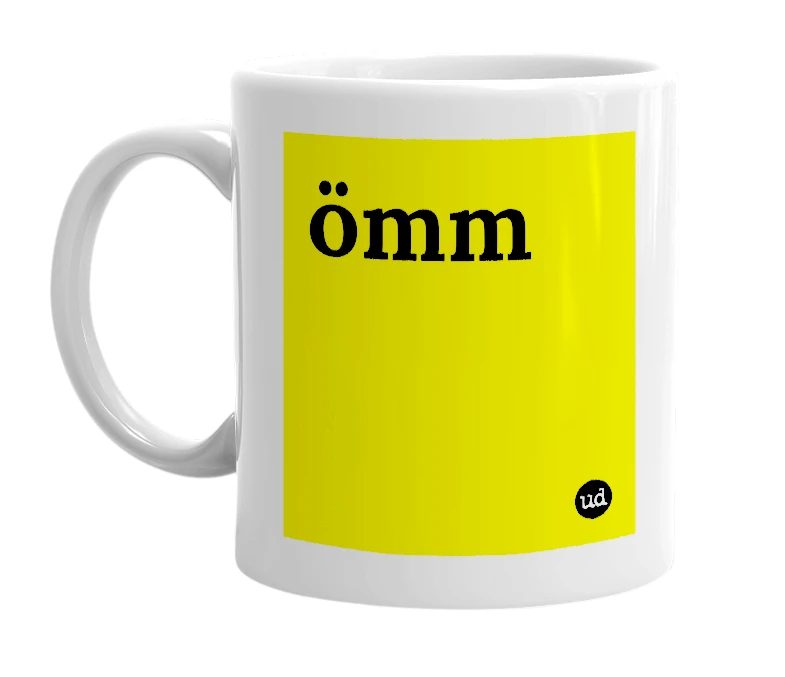 White mug with 'ömm' in bold black letters