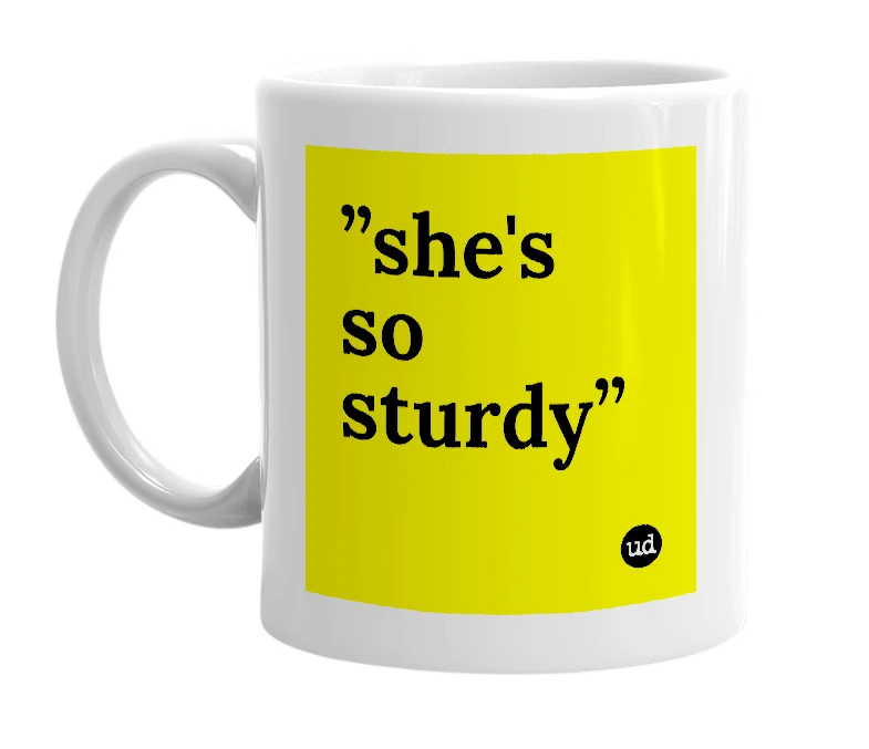 White mug with '”she's so sturdy”' in bold black letters